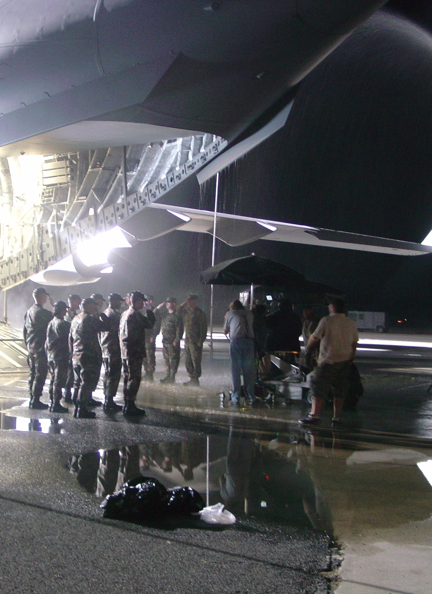 Servicemembers recreate scenes for at McGuire Air Force Base, N.J. for 'Taking Chance.'  The film portrays the experiences and encounters of Marine Lt. Col. Mike Strobl while accompanying Marine Pfc. Chance Phelps to his final destination.