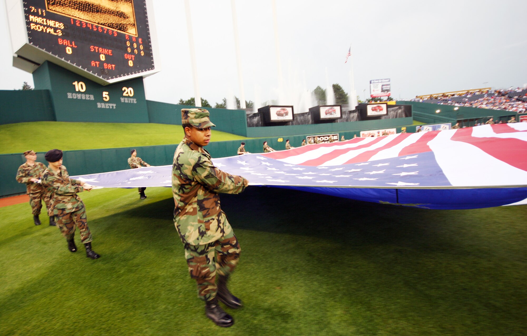KANSAS CITY, Mo. - More than 30 Team Whiteman members prepare the flag for display during the National Anthem July 4 at Kaufmann Stadium, home of the Kansas City Royals. (U.S. Air Force photo/Tech. Sgt. Matt Summers)