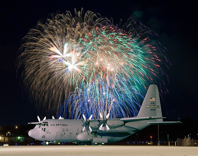 A C-130 from Air Force Reserve Command's 440th Airlift Wing at General Mitchell Air Reserve Station, Wis., sits on the 115th Fighter Wing ramp June 30, 2007, during the 15th annual Rhythm and Booms fireworks display, two miles distant. Rhythm and Booms is the largest fireworks display in the Midwest, drawing more than 200,000 spectators. The 440th AW is in the process of relocating from Milwaukee to Pope Air Force Base, N.C. (U.S. Air Force photo/Joe Oliva)