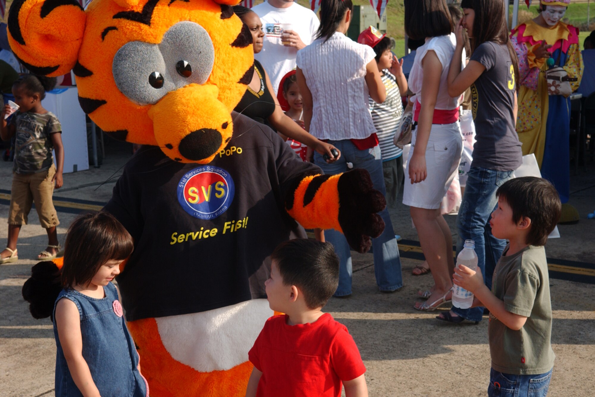 OSAN AIR BASE, Republic of Korea -- The 51st Services Squadron mascot entertains children during the July 4th celebration Liberty Fest on Osan.  Liberty Fest provided members of Team Osan with food, drink, and entertainment to celebrate the holiday, culminating with the firework display later in the night.  (U.S. Air Force photo by Staff Sgt. Christopher A. Marasky)