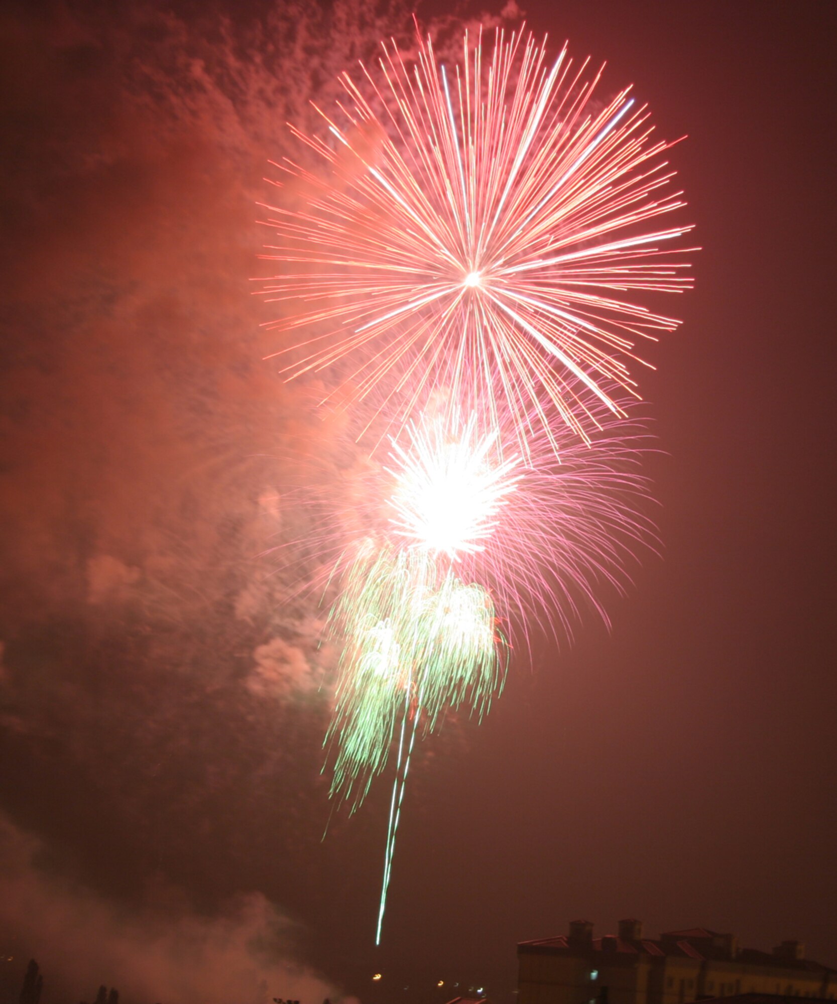 OSAN AIR BASE, Republic of Korea -- Fireworks explode high overhead during the July 4th celebration Liberty Fest held on Osan.  Liberty Fest provided members of Team Osan a chance to celebrate the 4th with food and games, and culminated with the fireworks at the end of the night.  (U.S. Air Force photo by Lieutenant Col. Michael Shavers)