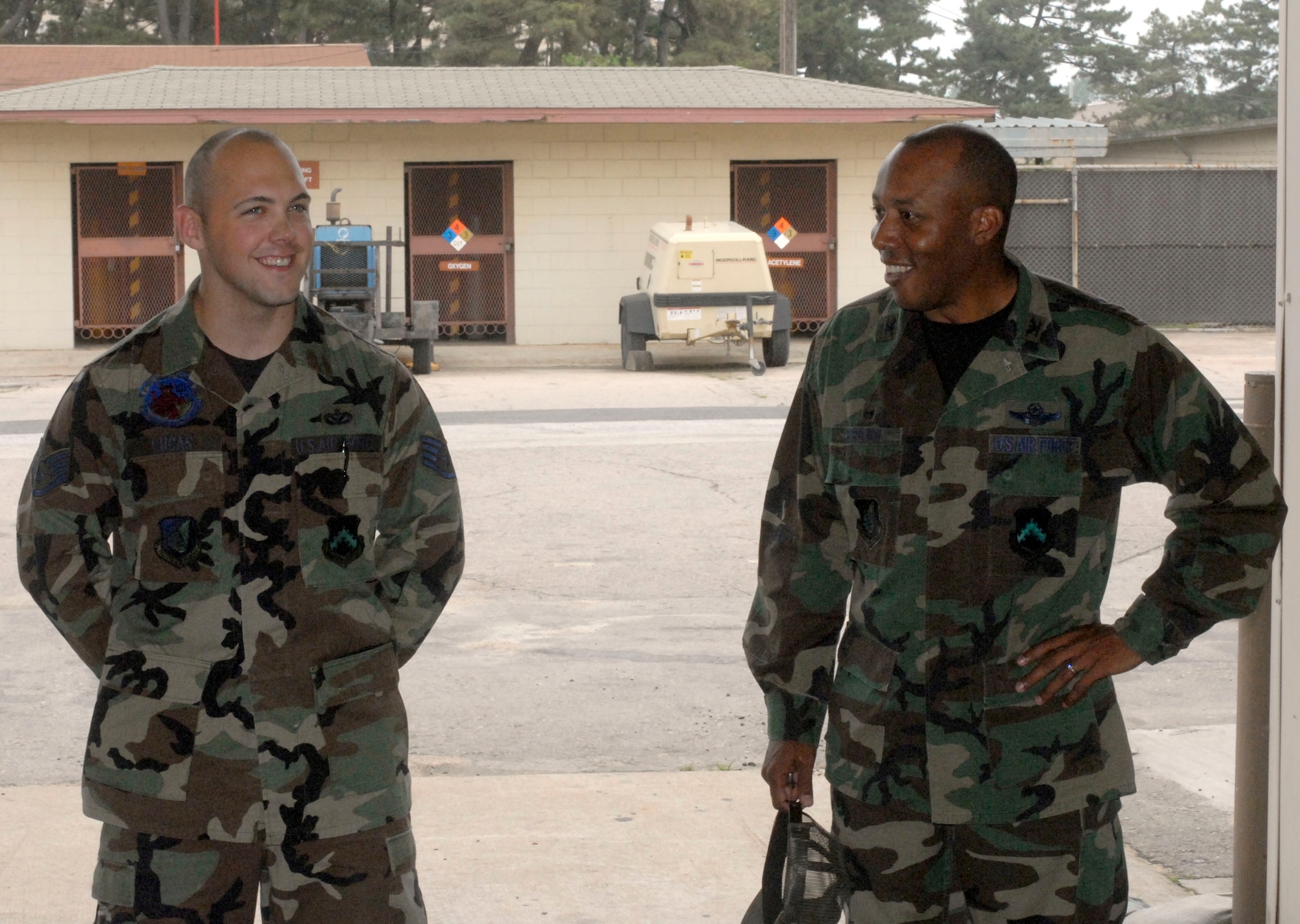KUNSAN AIR BASE, Republic of Korea -- Staff Sgt. Luke Lucas, 8th Civil Engineer Squadron, NCOIC of the base lock shop, receives a visit from Col. CQ "Wolf" Brown, 8th Fighter Wing commander. Sergeant Lucas was recognized as the "Pride of the Pack recently." (U.S. Air Force photo/SrA Steve Doty) 