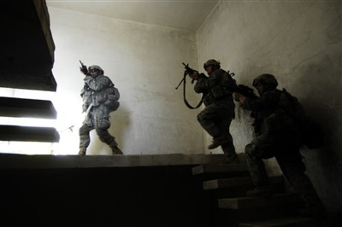 U.S. Army soldiers inspect a suspected insurgent base in the Arab Jabour region of Iraq on June 23, 2007.  