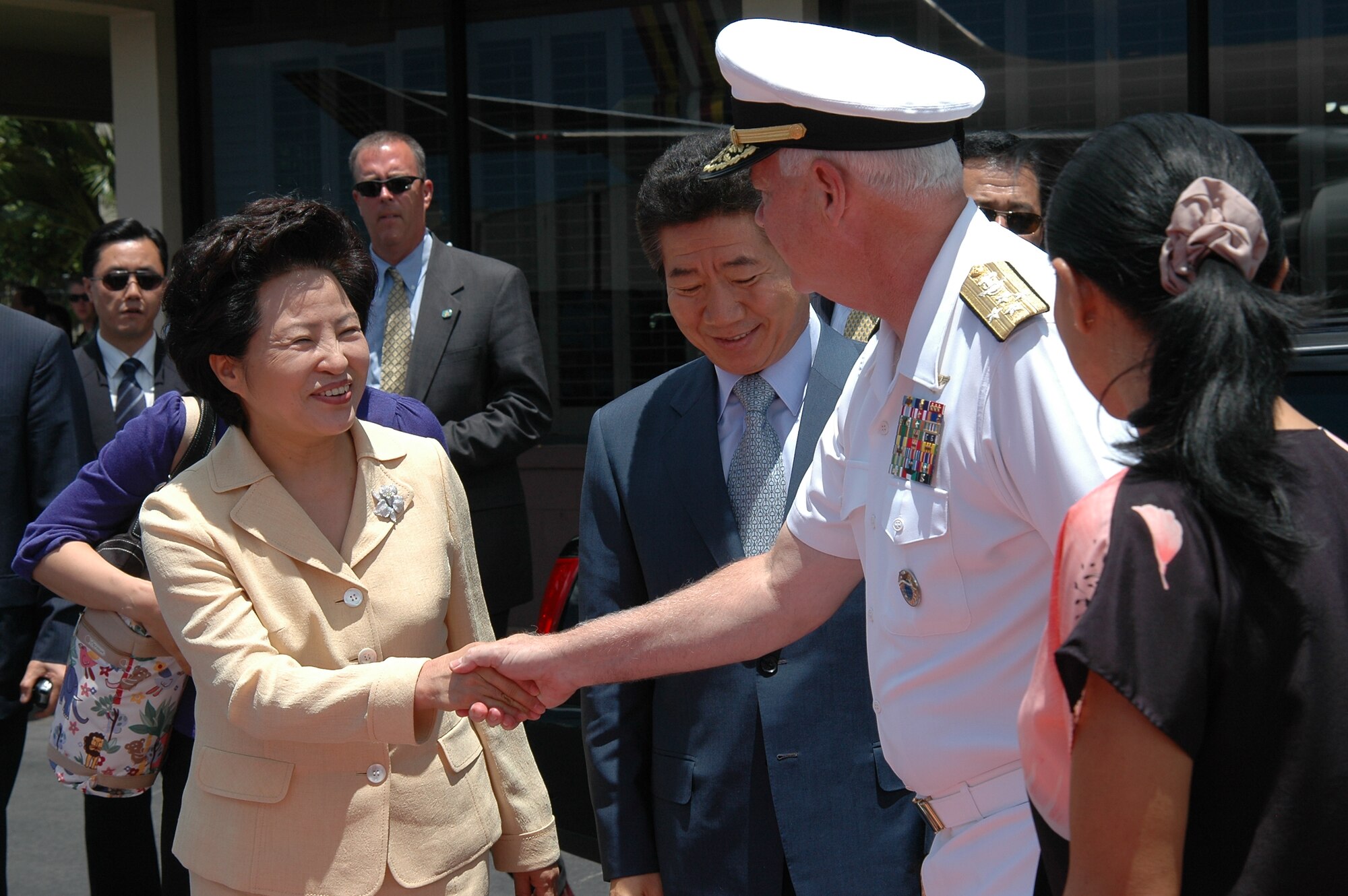 Adm. Timothy J. Keating, U.S. Pacific Command commander, greets First Lady Kwon Yang-suk and President Roh Moo-hyun just before their departure from Hickam Air Force Base.