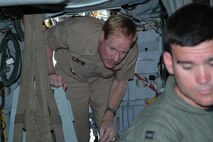 MINOT AIR FORCE BASE, N.D. – Rear Admiral Michael Miller, U.S. Navy, departs the cockpit of a B-52H Stratofortress during a tour here July 5. Admiral Miller is a native of Minot. (U.S. Air Force photo by Stefan Bocchino) 