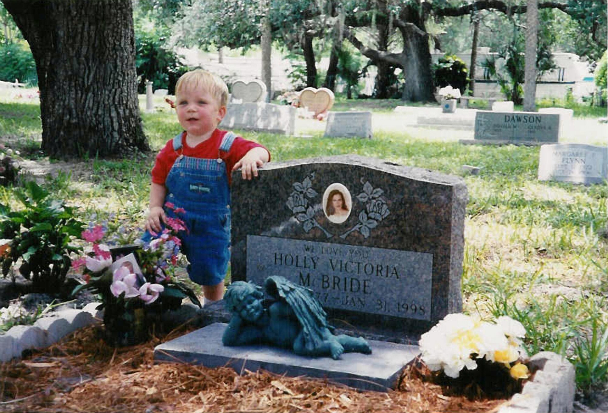 Dakota, Holly McBrides?s 13-month-old son, visits her gravesite at a cemetery in Bonita Springs, Fla., shortly after a drunk driver crashed 
into them.
