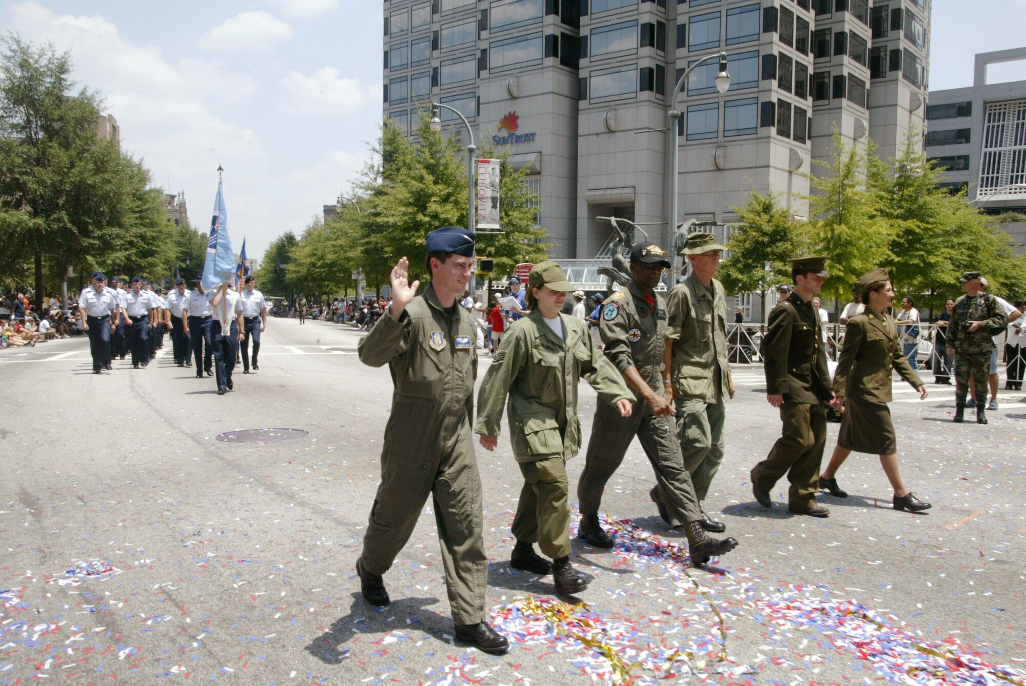 Personnel from Dobbins Air Reserve Base, Ga. including the 94th Airlift Wing and the 22nd Air Force Headquarters, along with various organizations from Warner Robins Air Force Base, Ga., dressed in period uniforms for the July 4 "Salute 2 America" parade in downtown Atlanta. They were followed by members in dress blues, flight suits, and battle dress uniforms, making up three flights representing the Air Force.(U.S. Air Force photo/Don Peek)