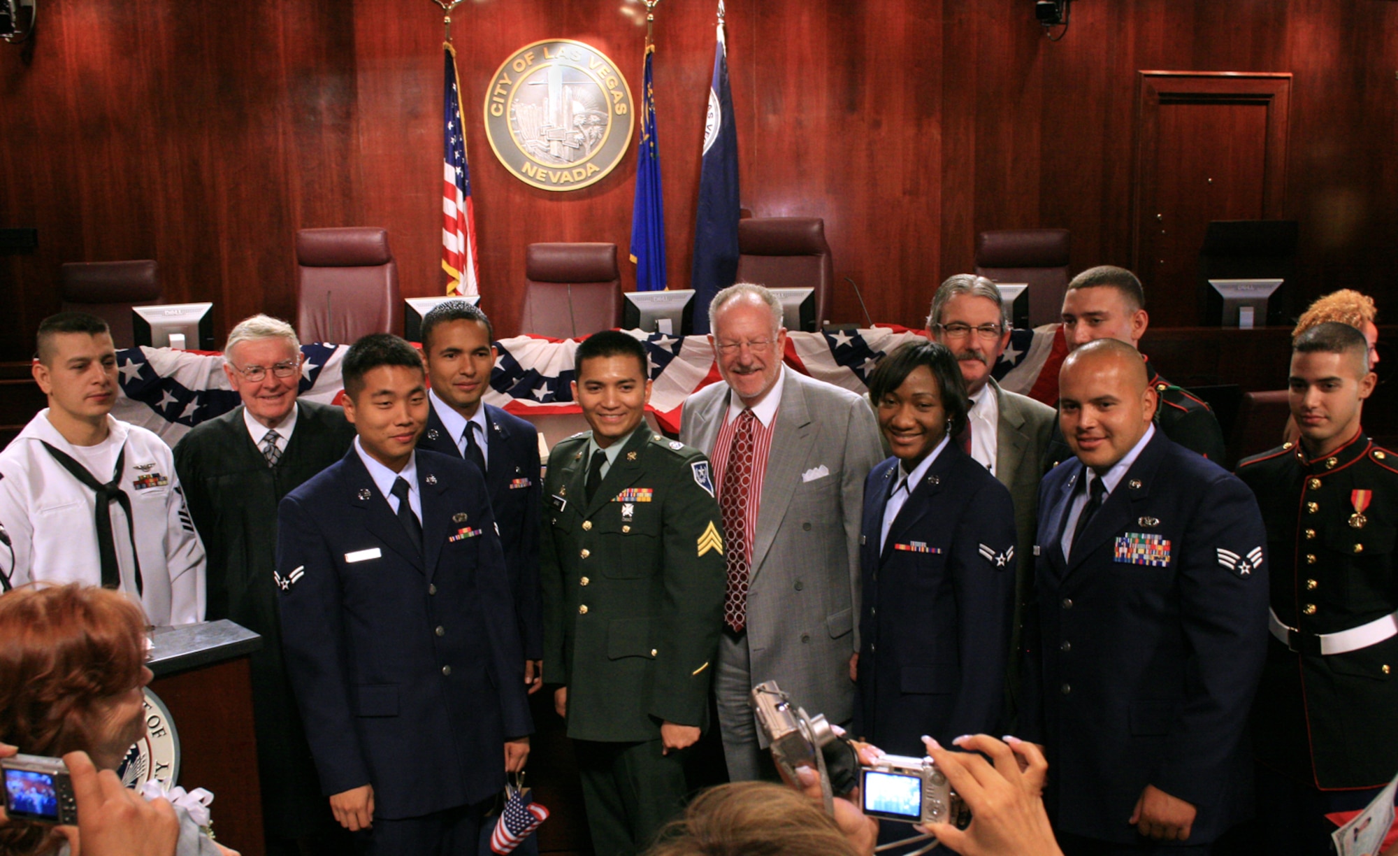 One Navy, two Marine and four Air Force members are posing with Las Vegas Mayor Oscar Goodman and the court officials immediately after their naturalization ceremony. Air Force personnel left to right Airman 1st Class Jung Park, Senior Airman Alvaro Solis-Esparza, Airman 1st Class Colleen Rexti, Senior Airman Ivan Carrillo-Moriel. (courtesy photo) 
