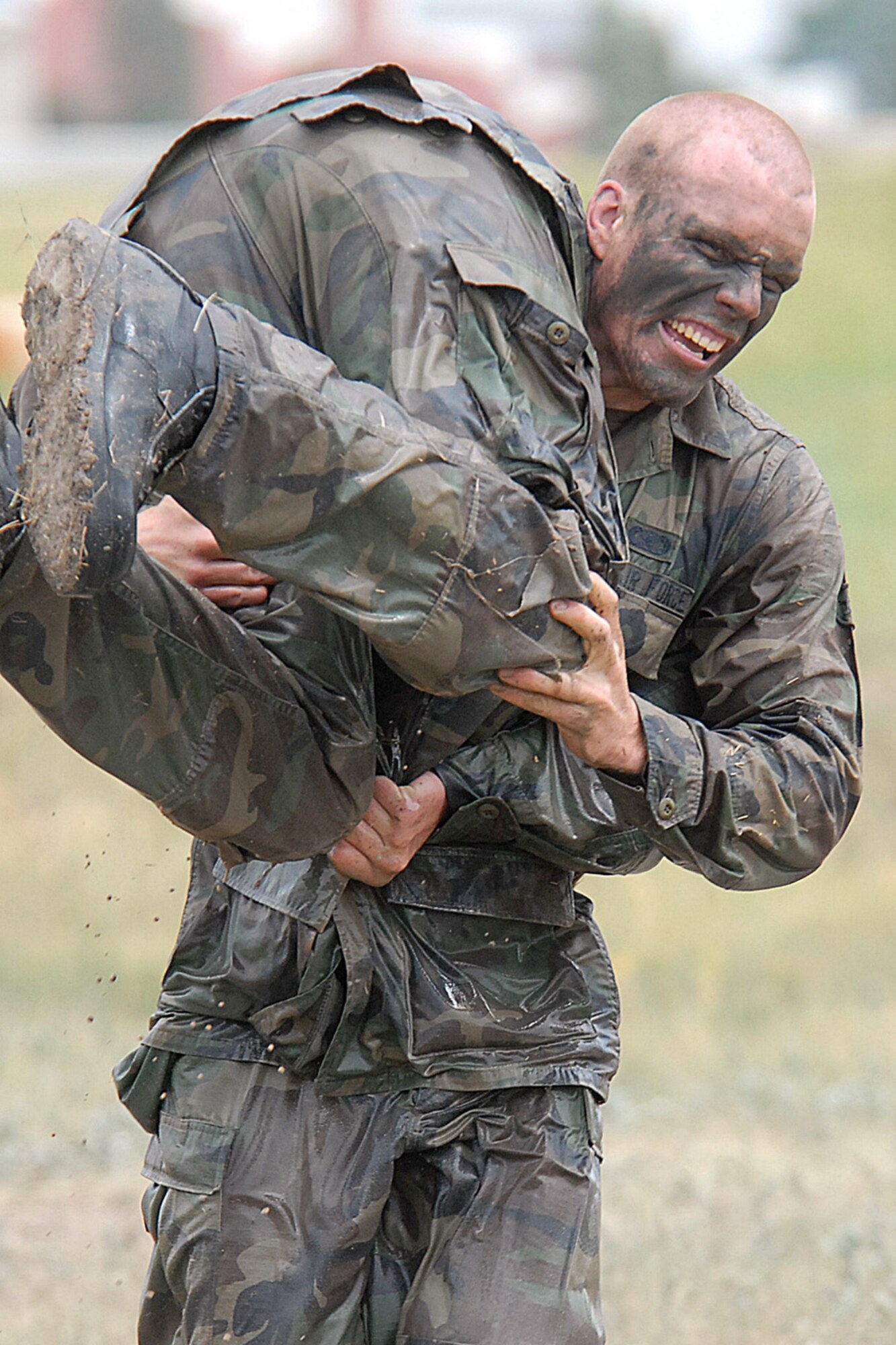 Airman Andrew Vautrin, 90th Security Forces Squadron, carries one of his teammates in a fireman carry during this year’s Crow Creek Challenge June 27 at the training complex. Airman Vautrin’s team took 2nd place out of 21 teams (Photo by Shelley Raffl).