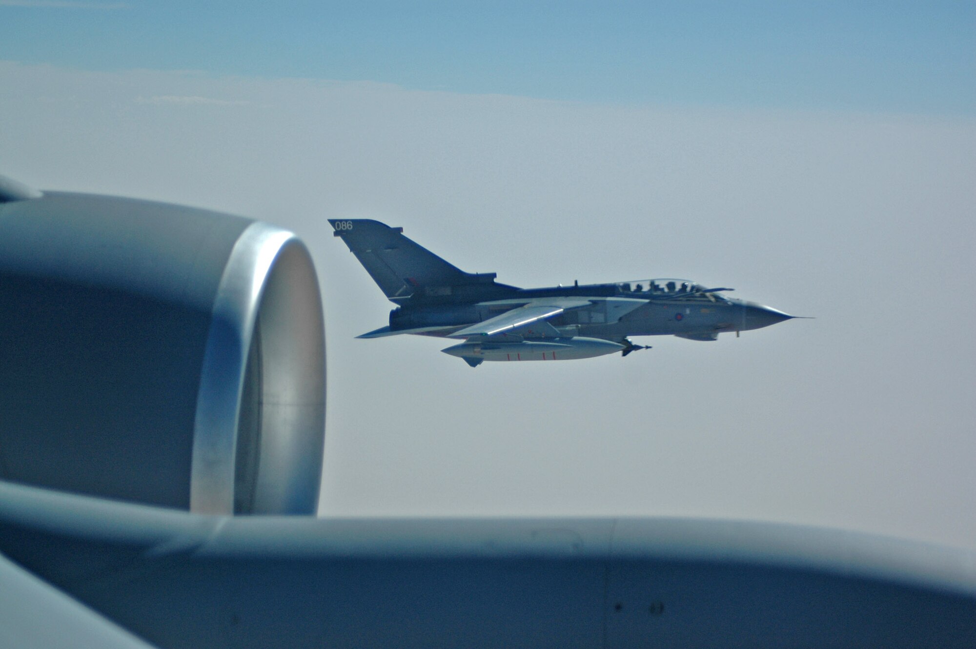 A Royal Air Force Tornado GR-4 flies alongside an Air Force KC-135R Stratotanker after an aerial refueling in Southwest Asia July 6. GR-4s fly sorties for both Operation Enduring and Iraqi Freedom. Coalition Stratotankers refuel more than 200 aircraft on a daily basis throughout the area of responsibility. (U.S. Air Force photo) 
