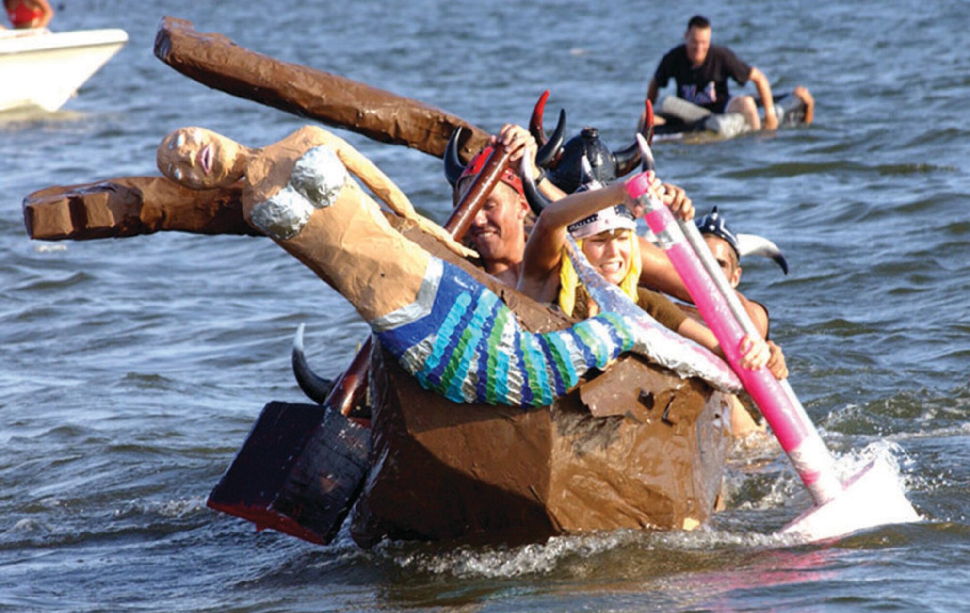 Another 1st Special Operations Logistics Readiness Squadron crew battles the waves to get back to the beach during the Cardboard Boat Regatta at Hurlburt's 29th Annual Sound of Independence at the marina June 29. (U.S. Air Force photo/Tech. Sgt. Angela Shepherd)