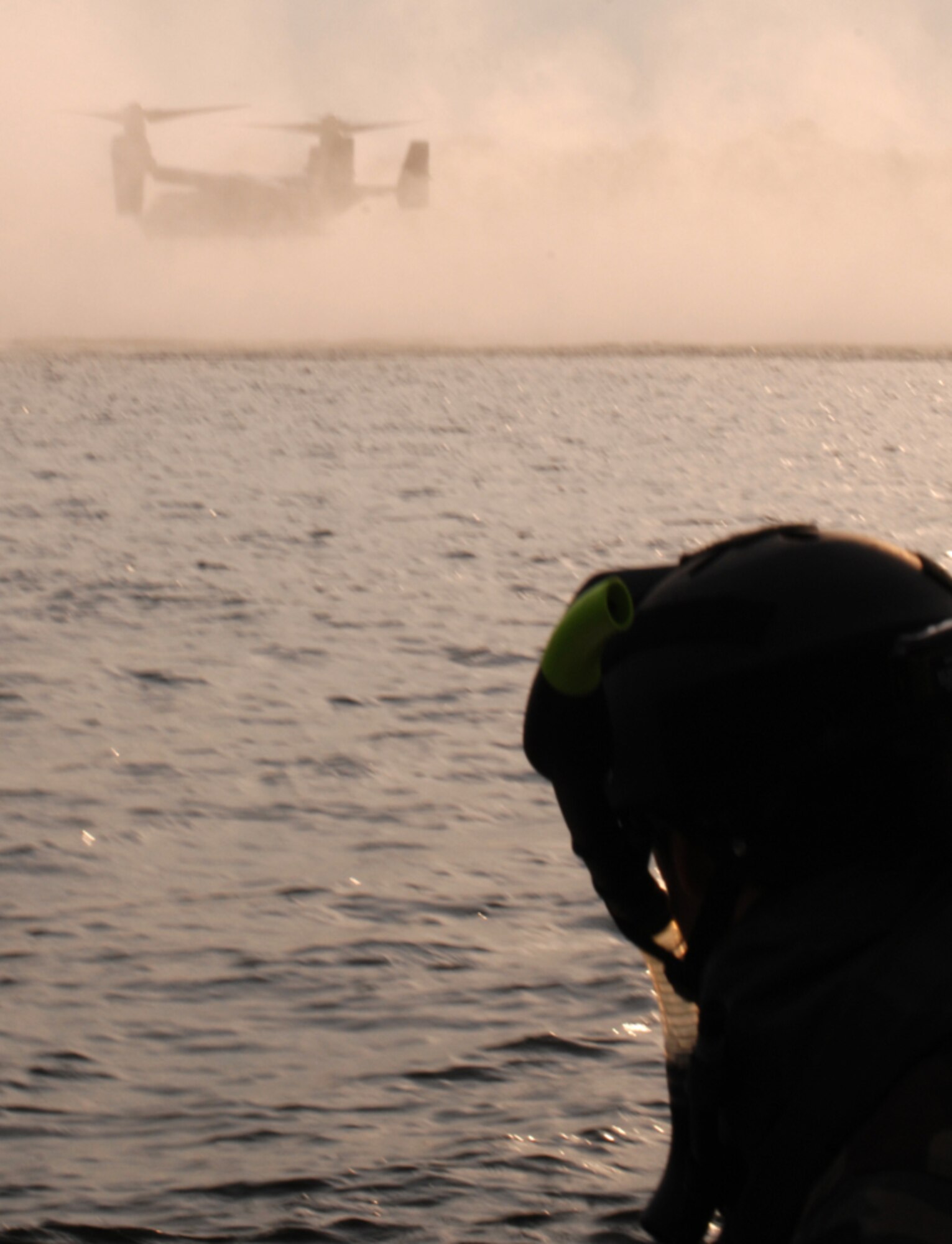 A Navy SEAL waits in the water for the CV-22 to retrieve him. (U.S. Air Force photo/Senior Airman Andy Kin)