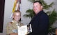 Master Sgt. Stephen B. Ladd congratulates his son, Shaun, for achieving the rank of Eagle Scout.  Shaun earned a total of 27 merit badges over a four-year period, and built  a relocatable guard house for the 316th Security Forces Squadron as part of a community service project for his final task to earn Eagle Scout.  Master Sgt. Ladd is assigned to the 316th Logistics Readiness Squadron Vehicle Operations Flight as equipment support supervisor. (Photo by Bobby Jones)
