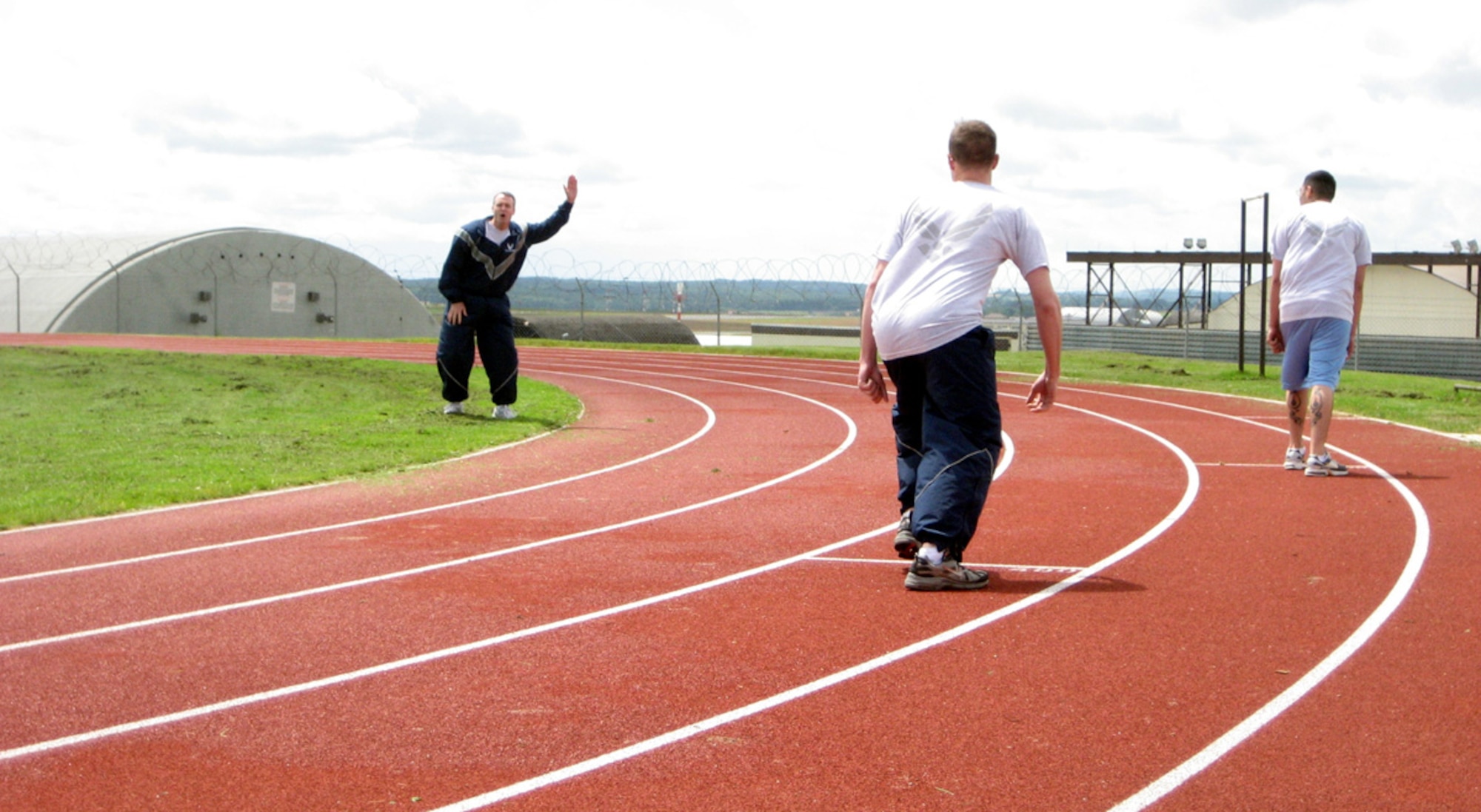 SPANGDAHLEM AIR BASE GERMANY -- Col. Darryl Roberson, 52nd Fighter Wing commander, calls the "On your mark, get set, go!" for Airmen participating in track events during the 52nd FW's Sport Day July 2, 2007. (U.S. Air Force photo/Staff Sgt. Andrea Knudson)