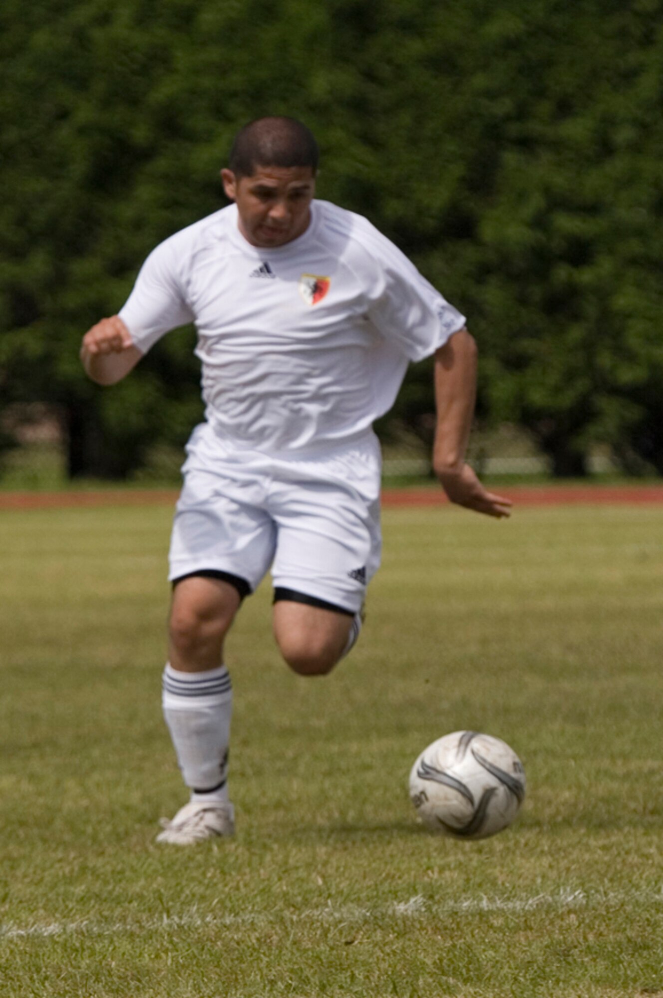 Mildenhall Marauders' Greg Posada; 100th Mission Support Squadron; is on the attack at RAF Alconbury in the USAFE soccer championship game. (U.S. Air Force photo by Master Sgt. Jeffrey Waits)