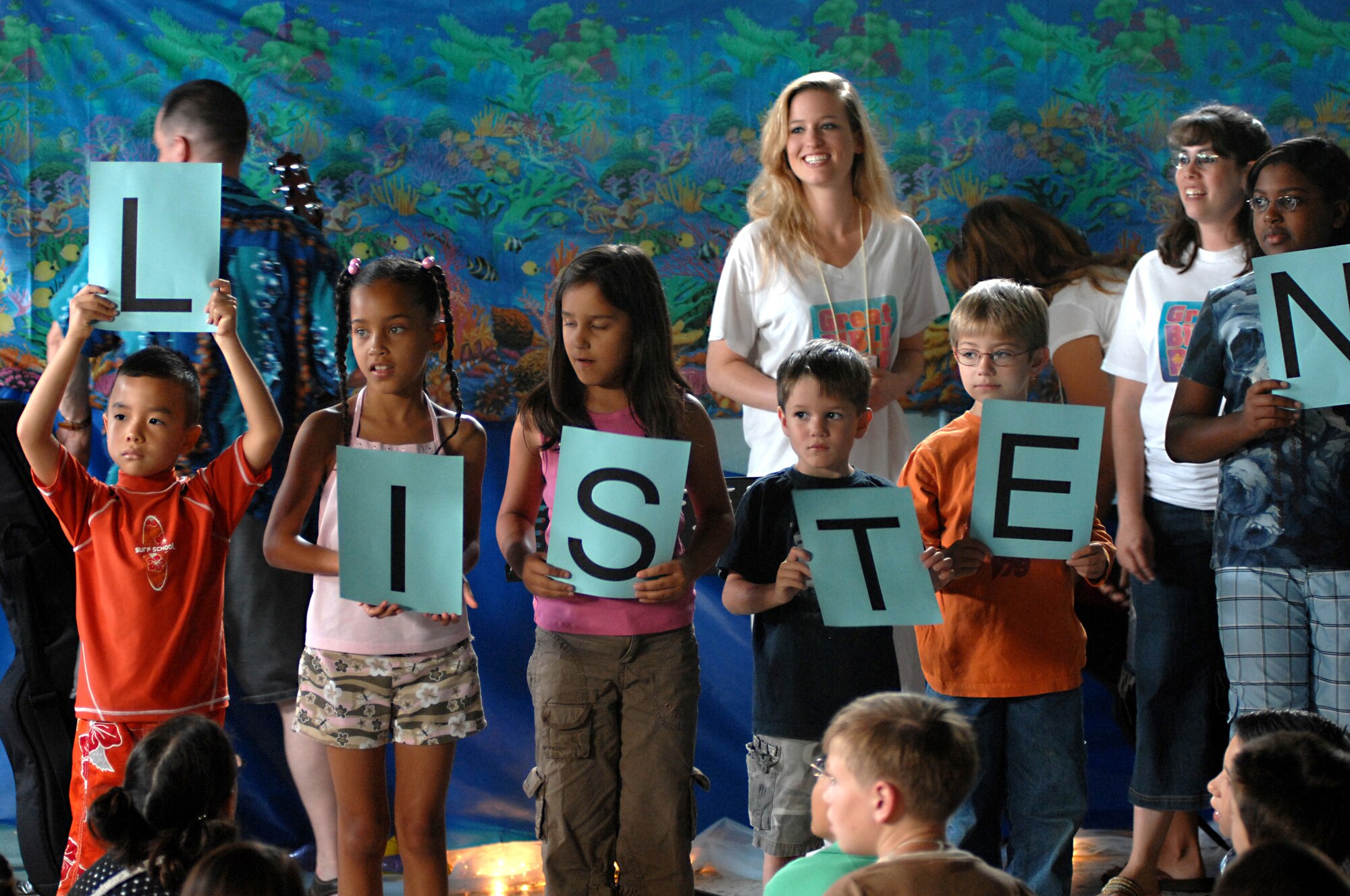 Vacation Bible School students use props while singing. The week-long school helped encourage kids to learn more about the Bible and continue their studies.  (U.S. Air Force photo by Airman 1st Class Nathan Doza)