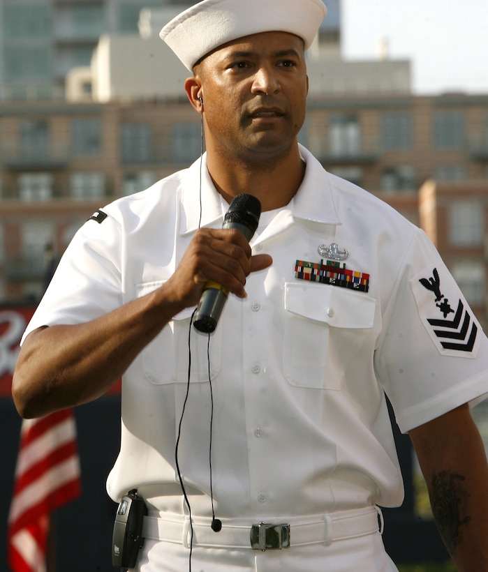 Navy Petty Officer 1st Class J.J. Gentry sings the national anthem as part of the San Diego Padres’ salute to the military at Petco Park, July 4, 2007. Photo by Lance Cpl. Nathaniel Sapp, USMC