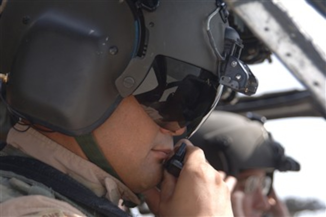 U.S. Army Capt. Tyson Hise and Chief Warrant Officer Semi Lemafa (left) prepare their UH-60 Black Hawk helicopter for take off at Bagram Airfield in the Parwan province of Afghanistan on June 29, 2007.  Hise and Lemafa are both assigned to the General Aviation Support Battalion, 82nd Combat Aviation Brigade, 82nd Airborne Division.  