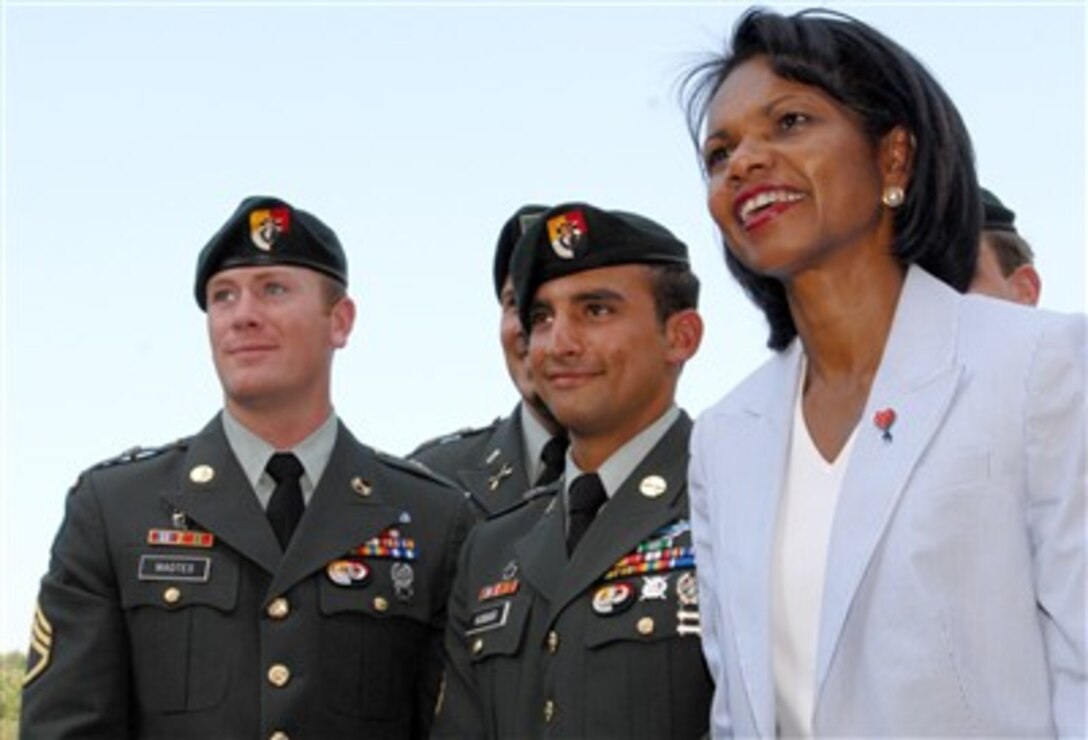 Soldiers of the Army's 3rd Special Forces Group from Fort Bragg, N.C., pose for photos with Secretary of State Condoleezza Rice, July 6, 2007, during the AT&T National golf tournament at Congressional Country Club in Bethesda, Md. 