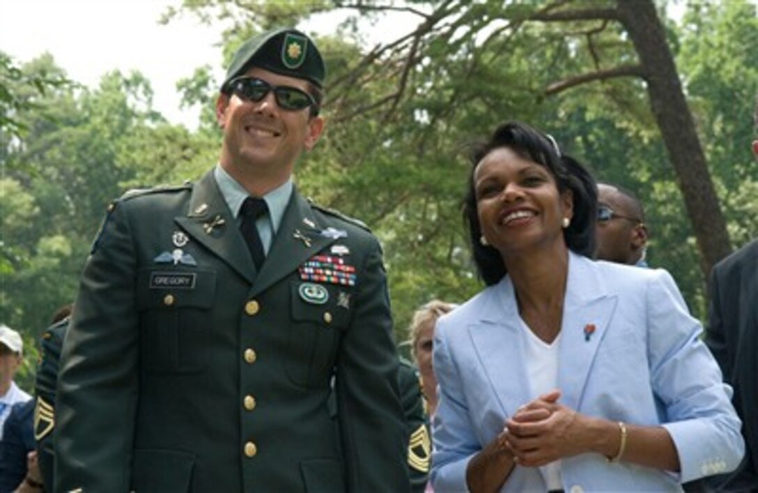 U.S. Army Maj. Jim Gregory, commanding officer of the 3rd Special Forces Group, shares a light moment with Secretary of State Condoleezza Rice at the AT&T National golf tournament, July 6, 2007, in Bethesda, Md. Gregory's detachment recently returned from Afghanistan.
