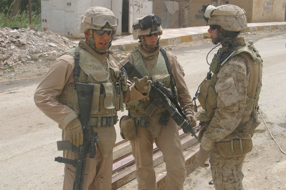 BARWANAH, Iraq ? Sgt. Anthony C. Galloway, section leader, 1st Squad, 4th Platoon, Alpha Company, 1/3 briefs his Marines while holding security at a bridge in Barwanah.