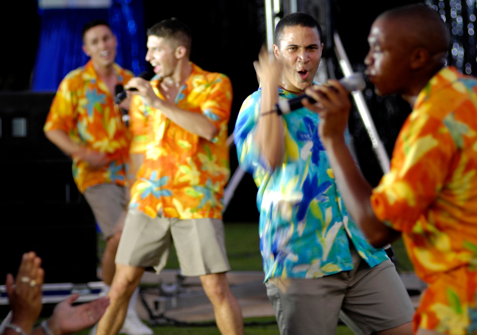 Tops in Blue performers sing a "Beach Boys" song during a show at Air Force Week St. Louis, July 6.  The show, held at the Saint Louis Science Center, archery field, attracted more than 1,500 spectators. (U.S. Air Force photo/Staff Sgt. Brian Ferguson)