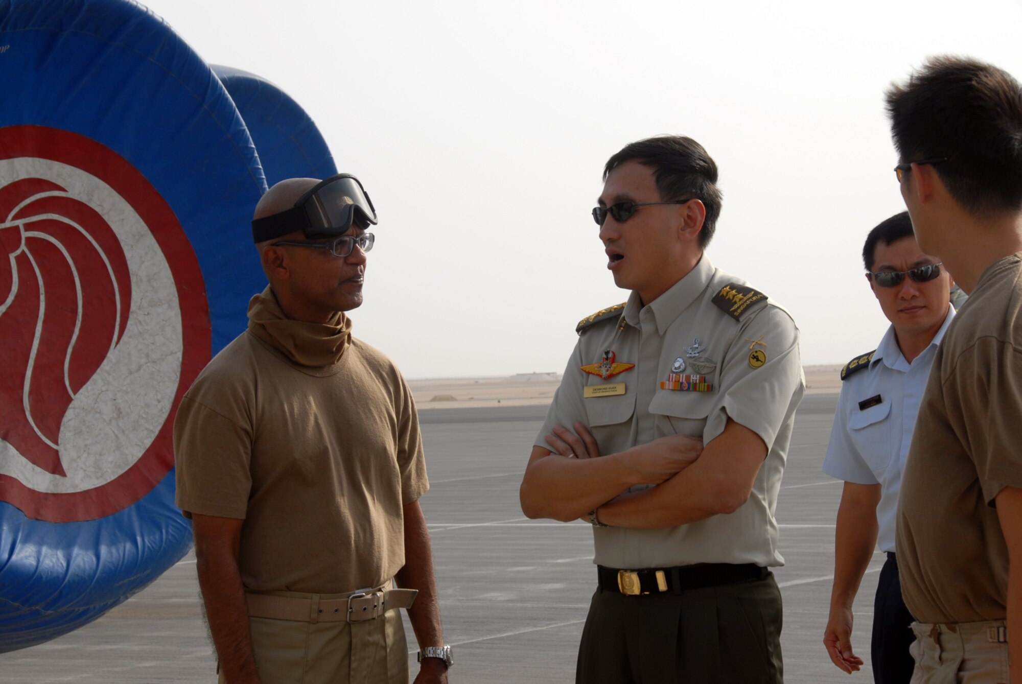 Royal Singapore Air Force Lt. Gen. Kuek Bar Chye, Chief, Defence Force, visited RSAF servicemembers July 2. While here, General Kuek visited the Combined Air Operations Center, Ops Town and the flightline. (U.S. Air Force photo by Airman 1st Class Ashley Tyler)
