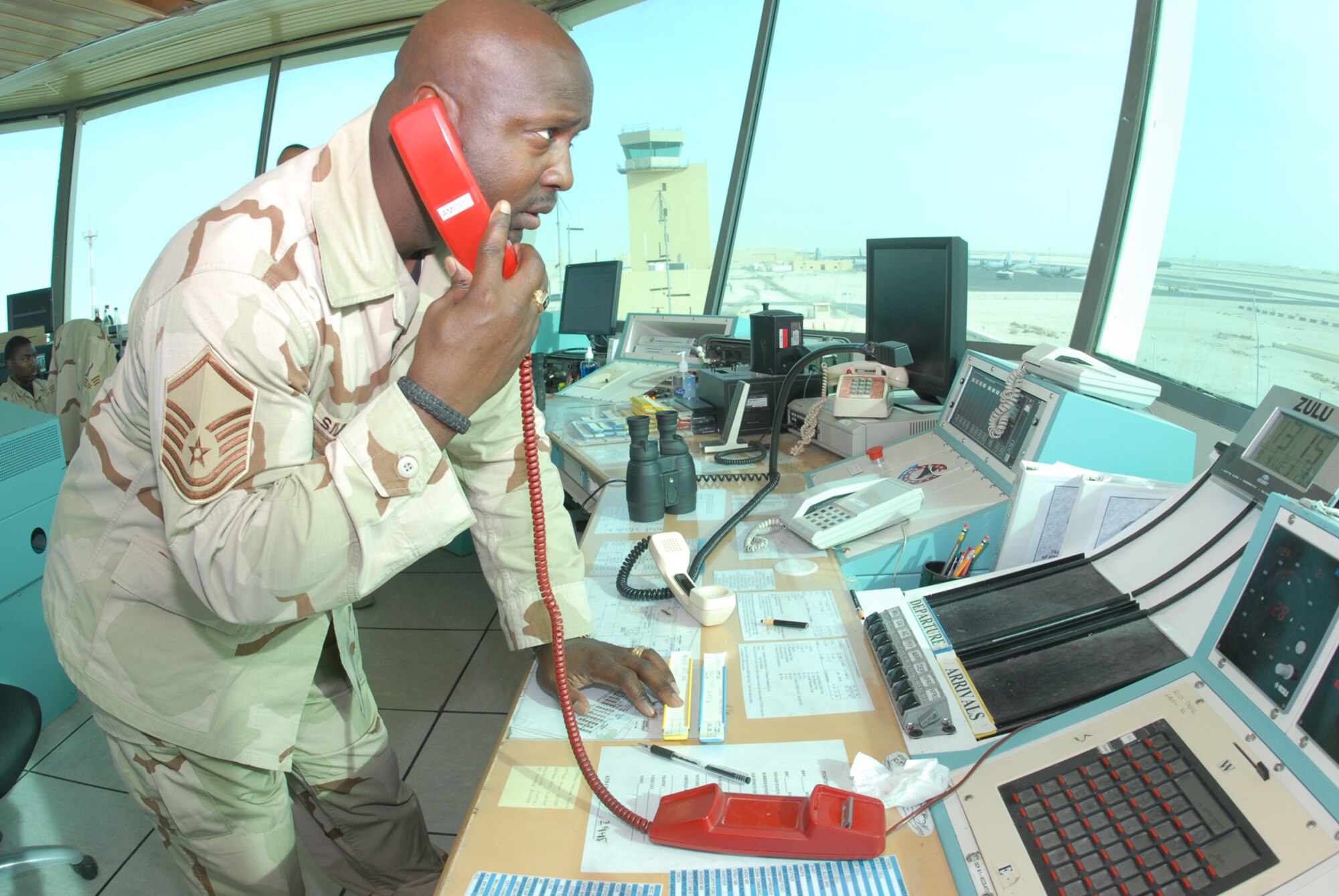 Master Sgt. Art Small, 379th Expeditionary Operations Support Squadron, works in the base’s air control tower and helps coordinate the arrival and departure of all aircraft here, regardless of service. (U.S. Air Force by Airman 1st Class Ashley Tyler)