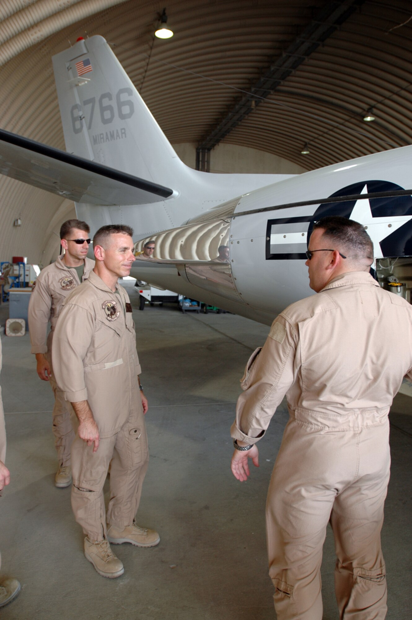 Marine Gunnery Sgt. Joel Fermaglich, UC-35 crew chief, conducts a walk-around inspection with Marine  Maj. Dan Burton, UC-35 pilot.  (U.S. Air Force photo by Capt. Teresa Sullivan)