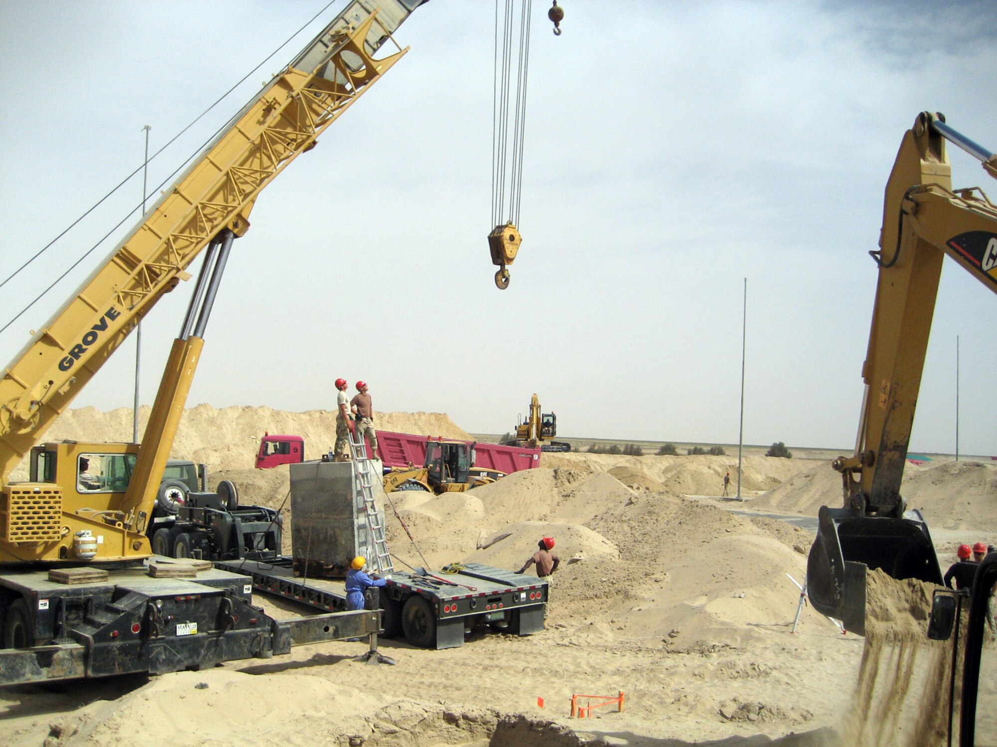 Airmen from the 1st Rapid Engineer Deployable Heavy Operational Repair Engineer Group work at a construction site at a forward-deployed location in the AOR. About 120 RED HORSE Airmen from the group based here deploy to various locations throughout the Southwest Asia to support ongoing missions. (U.S Air Force photo)