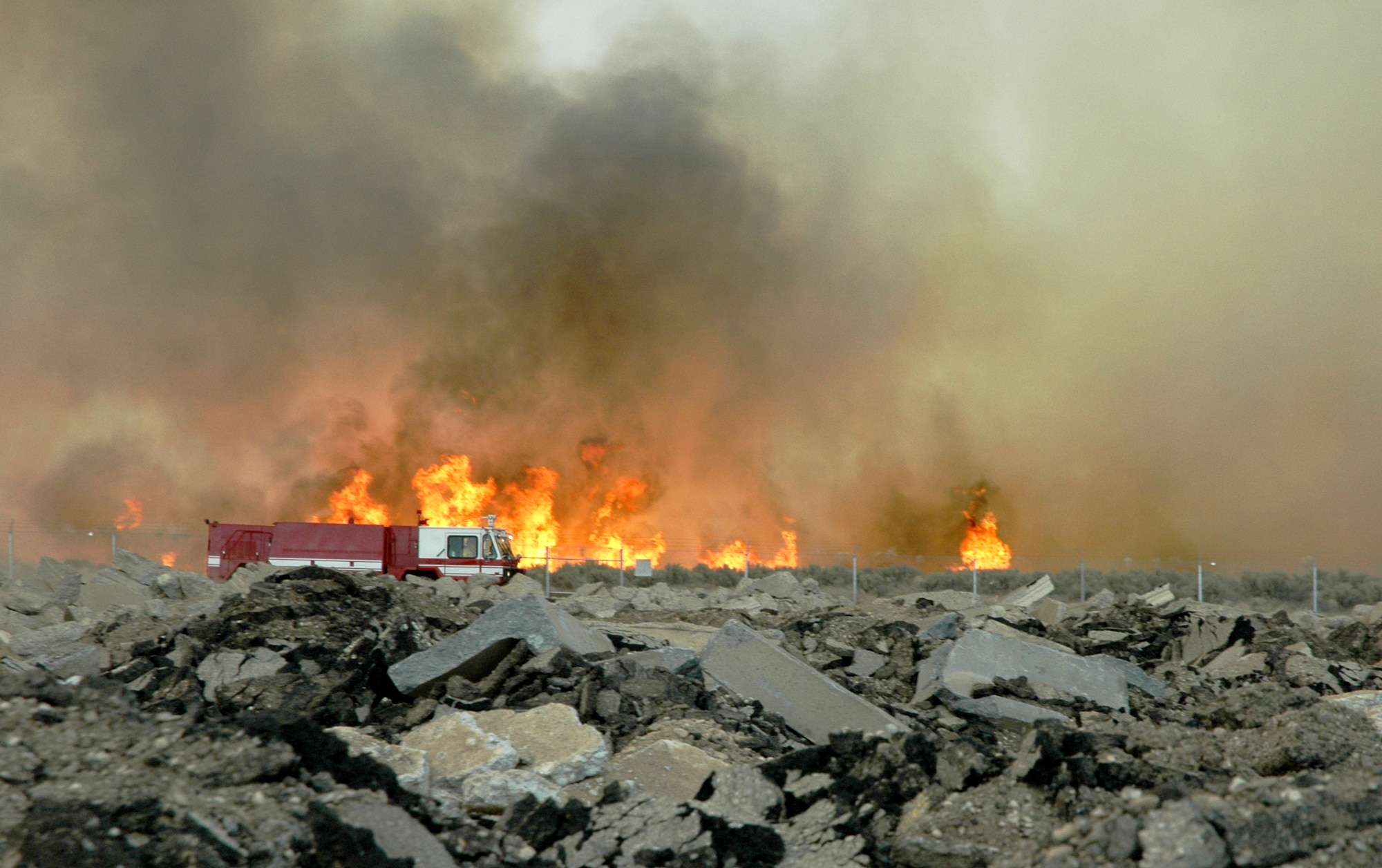 MOUNTAIN HOME AIR FORCE BASE, Idaho -- Base firefighters respond to a wildfire sparked by lightning near the Grandview Gate at approximately 5:30 July 6. Base Airmen, along with firemen from Mountain Home and the Idaho Bureau of Land Management, responded to one on-base fire and two off-base fires during the evening. The three fires consumed a combined total of almost 6,000 acres. (U.S. Air Force photo/Maj. Damien F. Pickart)