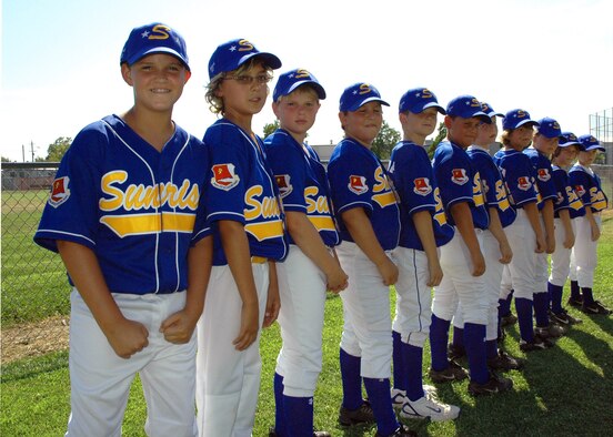 The Sunrise Little League all-stars proudly show off the newest patch on their uniforms. The team is wearing the unit patch of the Air Force Reserve's 940th Air Refueling Wing, Beale AFB, Calif., to honor their local military heroes. Ten year old Colton Nelson, seventh from the left, is particularly proud, as his uncle, Master Sgt. Hector Aguilar, a transportation specialist with the 940th Logistics Readiness Squadron, is deployed to Afghanistan in support of the Global War on Terror. The team won their first game July 5 with a score of 10-5, dropped their second game July 6, but won the third 6-3, July 7, to advance in the double elimination tournament. The team will take to the field again tonight at 6 p.m. at the La Sierra Community Center ball fields, in Carmichael, Calif. (U.S. Air Force photo/Master Sgt. Ellen L Hatfield)