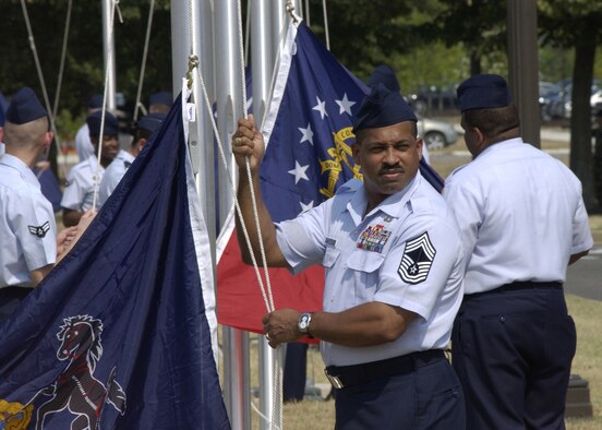 Chief Master Sgt. Sidney McNeil, 11th Civil Engineer Squadron, waits for the signal to raise his flag during a ceremony July 9 as part of the Arnold Gate dedication ceremony at Bolling. Re-establishing Bolling’s Avenue of Flags, the ceremony involved the simultaneous rising of 56 different flags by members of the Bolling community representing the 50 states, as well the District of Columbia, Guam, Puerto Rico, American Samoa, Northern Marianna Islands and the U.S. Virgin Islands. (U.S. Air Force photo by Airman 1st Class Sean Adams)
