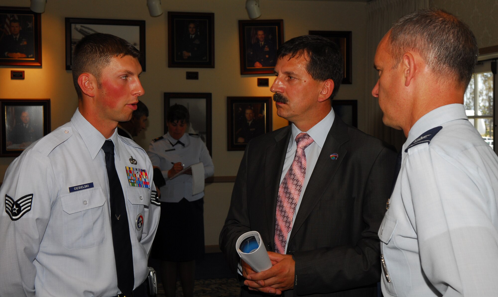 Staff Sgt. Radoslaw Ciesielski, the 30th Space Wing and 14th Air Force building manager, translates for Col. Michael Fortney, 30th Space Wing Vice Commander, during an interaction with a Polish senator. Vandenberg officials host three senators of the Republic of Poland who visited the base on June 29 as part of the U.S. State Department's International Visitor Leadership Program. (U.S. Air Force photo/Airman 1st Class Robert Lewis) 
