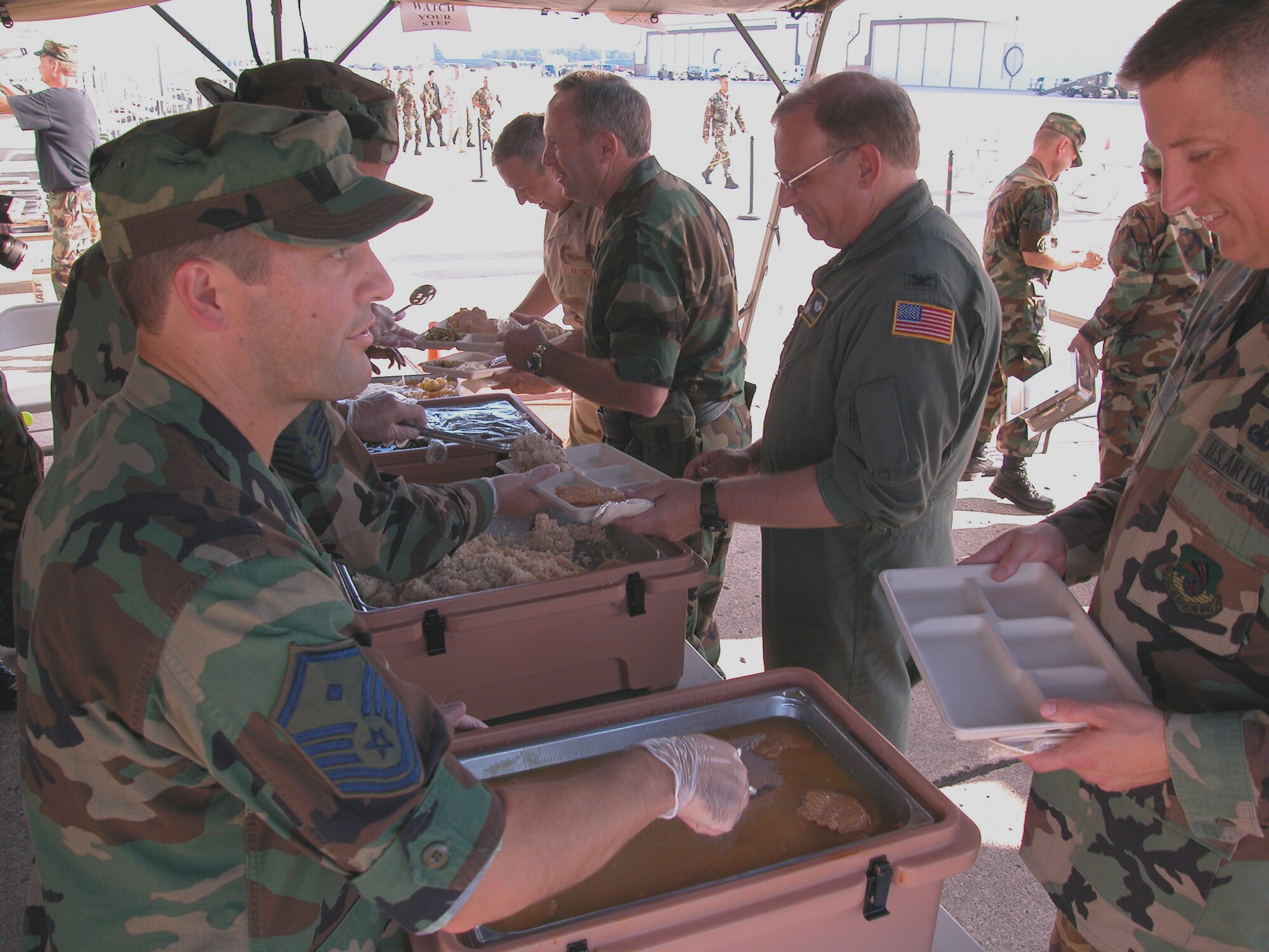 GRISSOM AIR RESERVE BASE, Ind., -- Participants at Grissom's Combat Dining In enjoy a hot meal prepared with the base's Single Pallet Expeditionary Kitchen -- or SPEK.  The light weight modular kitchen is air transportable, fits on a single pallet, and can feed from 250 to 500 people, using a small cooking staff.  (U.S. Air Force photo/Senior Airman Chris Bolen)
