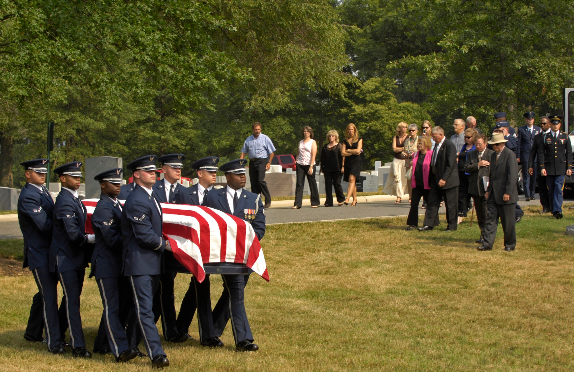 Air Force Honor Guard pallbearers carry the coffin of former Chief Master Sergeant of the Air Force Gary R. Pfingston to his burial site at Arlington National Cemetery, Va., July 6. The 10th CMSAF was born in Evansville, Ind., and entered the Air Force in February 1962. He passed away June 23 in San Antonio. (U.S. Air Force photo/Senior Airman Rusti Caraker)