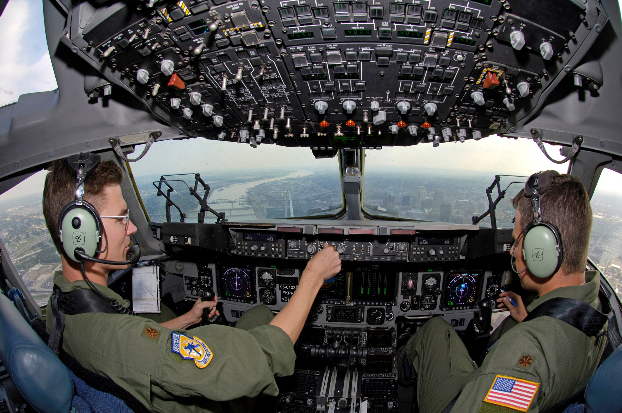 Majors Erin Meinders and Henry Triplett from the 437th Airlift Wing at Charleston Air Force Base, S.C., perform a fly-by before a St. Louis Cardinals baseball game as part of Air Force Week. (U.S. Air Force photo/Staff Sgt. Tony Tolley)