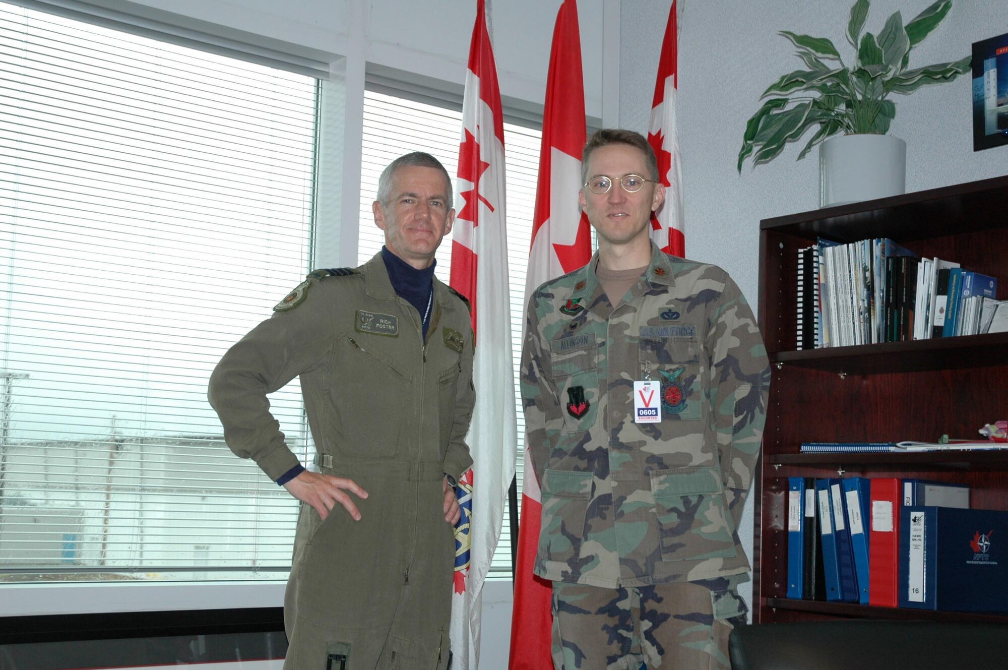 Canadian Colonel R.D. Foster, commander of 15th Wing, Moose Jaw, meets with Major Matthew Allison, 147th Civil Engineer Squadron commander. (Texas National Guard photo/Senior Master Sgt. Marcus Falleaf)