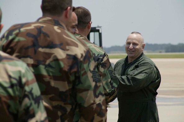 SHAW AIR FORCE BASE, S.C. --  Members of the 20th Fighter Wing line up to shake hands with Chief Master Sgt. Gary Rutledge, 20th FW command chief, after his final flight July 6. Chief Rutledge is retiring after 30 years of service. (U.S. photo/Senior Airman Holly MacDonald)