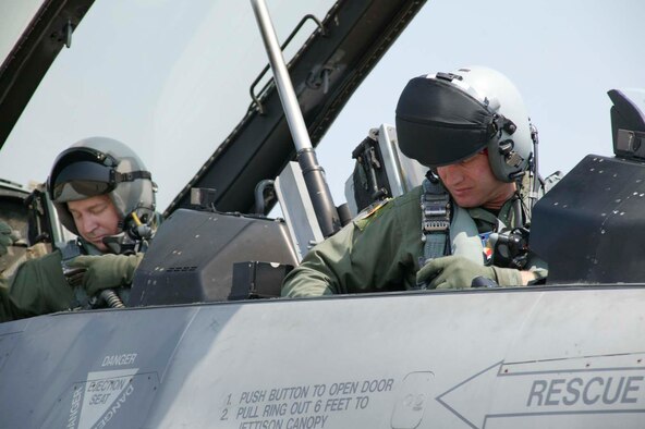 SHAW AIR FORCE BASE, S.C. -- (From Right) Col. James Post, 20th Fighter Wing commander, and Chief Master Sgt. Gary Rutledge, 20th FW command chief, strap in for his final flight July 6. Chief Rutledge is retiring after 30 years of service. (U.S. Air Force photo/Senior Airman Holly MacDonald)