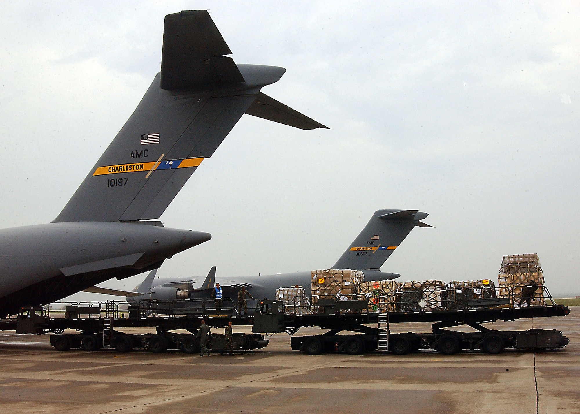 As the sun begins to set over the Incirlik flightline, a five-person load team wraps up their ninth mission of the day including the upload of a six pallet train, or T-6. Trains can range anywhere from T-2 through T-6, with a T-6 being the largest possible.  (U. S. Air Force photo by Tech. Sgt. Patrick Hyde)