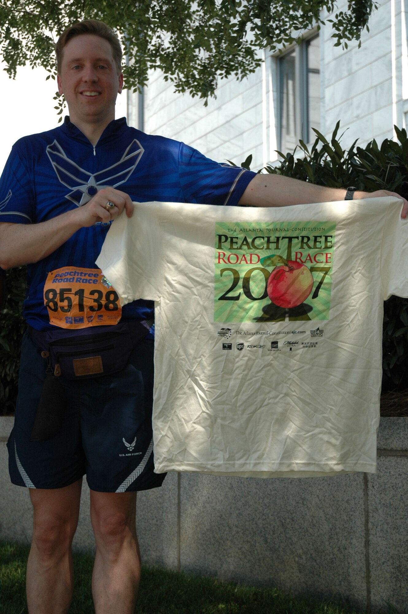 Maj. Mark Jordan, 94th Operations Group, Dobbins Air Reserve Base, Ga., proudly holds his Peachtree Road Race T-shirt after completing the annual July 4 run in downtown Atlanta. The shirts are a status symbol among runners, not only in the Southeast, but around the world. 