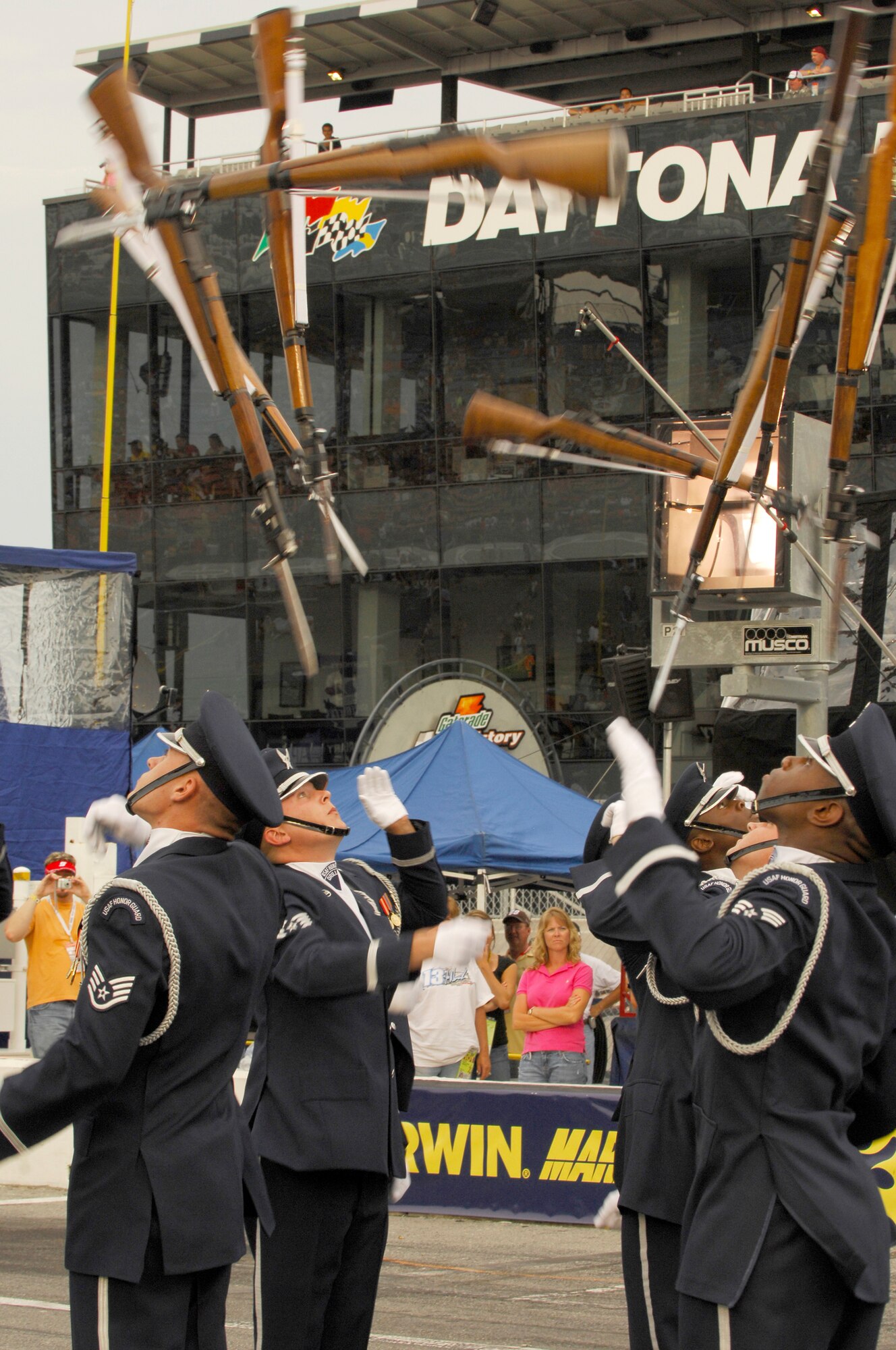 Members of the Drill Team perform their large 16-man sequence, wowing a crowd of more than 150,000 during the pre-race events at NASCAR's Pepsi 400 in Daytona, Fla. on July 7th. The Drill Team is the traveling component of the Air Force Honor Guard and tours Air Force bases world wide showcasing the precision of today's Air Force to recruit, retain, and inspire Airmen for the Air Force mission. (U.S. Air Force photo by Airman 1st Class Alexandre Montes)(Released) 