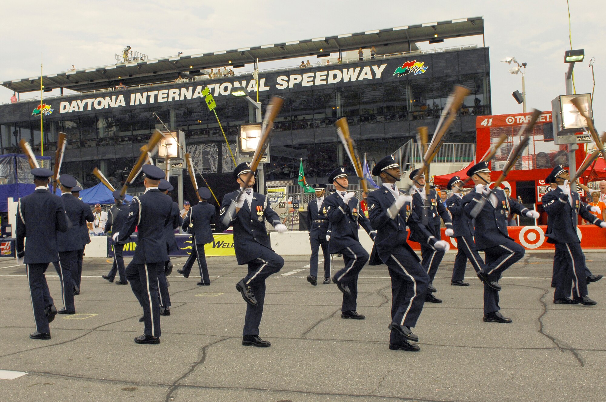 Members of the Drill Team perform their large 16-man sequence wowing a crowd of more than 150,000 during the televised pre-race events at NASCAR's Pepsi 400 in Daytona, Fla. on July 7th. The Drill Team joined the Secretary of the Air Force, Michael Wynne, celebrating the Air Force's 60th anniversary with NASCAR fans and representing the Air Force as a part of the "America Supports You" program honoring all servicemembers this race weekend.  The NASCAR event kicked-off the team's current tour as they visit MacDill AFB and Hurlburt Field, later this week. (U.S Air Force photo by Airman 1st Class Alexandre Montes) (Released)