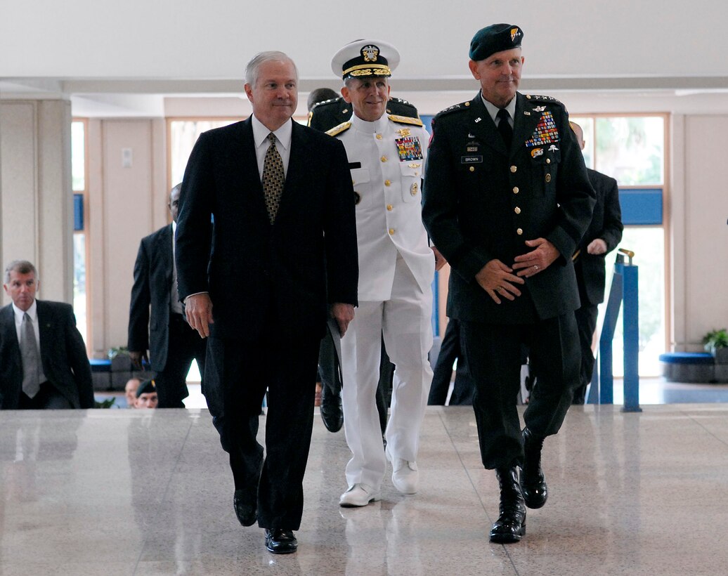Secretary of Defense Robert M. Gates, U.S. Navy Adm. Eric T. Olson, and Army Gen. Doug Brown, commander of U.S. Special Operations Command arrive at the change of command ceremony at the Tampa Convention Center in Tampa, Fla., July 9, 2007.  Brown, who has commanded USSOCOM since September 2003, is retiring from active duty after 40 years of service to the nation.  Olson has been the deputy commander of USSOCOM since September 2003.