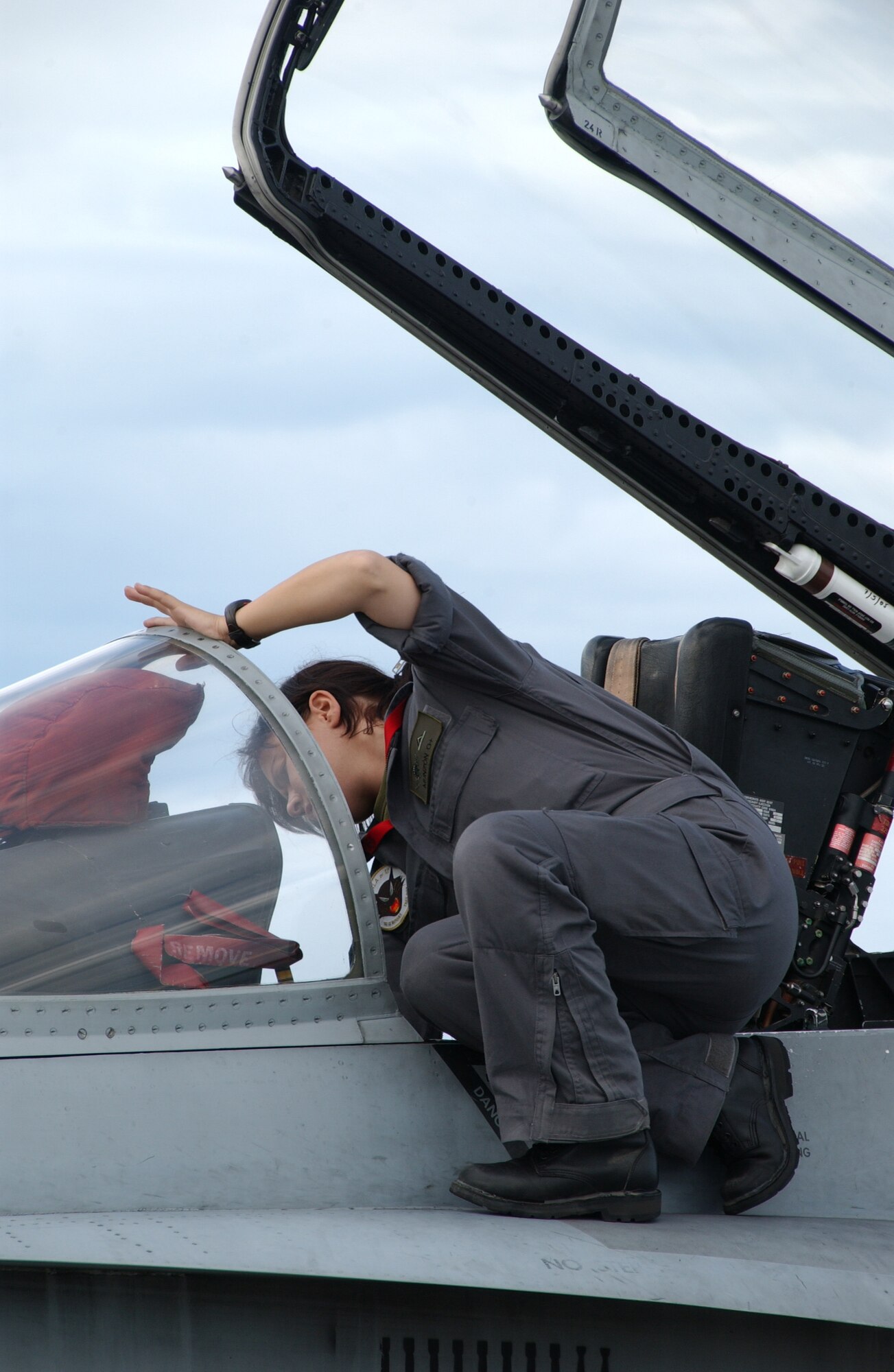 EIELSON AIR FORCE BASE, Alaska -- A member of the Spanish Air Force, 12th Fighter Wing, Torrejon Air Base Spain, cleans the inside canopy of F-18 hornet July 10, 2007.  Red Flag-Alaska, a series of Pacific Air Forces commander-directed field training exercises for U.S. forces, provides joint offensive counter-air, interdiction, close air support, and large force employment training in a simulated combat environment. (U.S. Air Force photo by Airman 1st Class Christopher Griffin) 