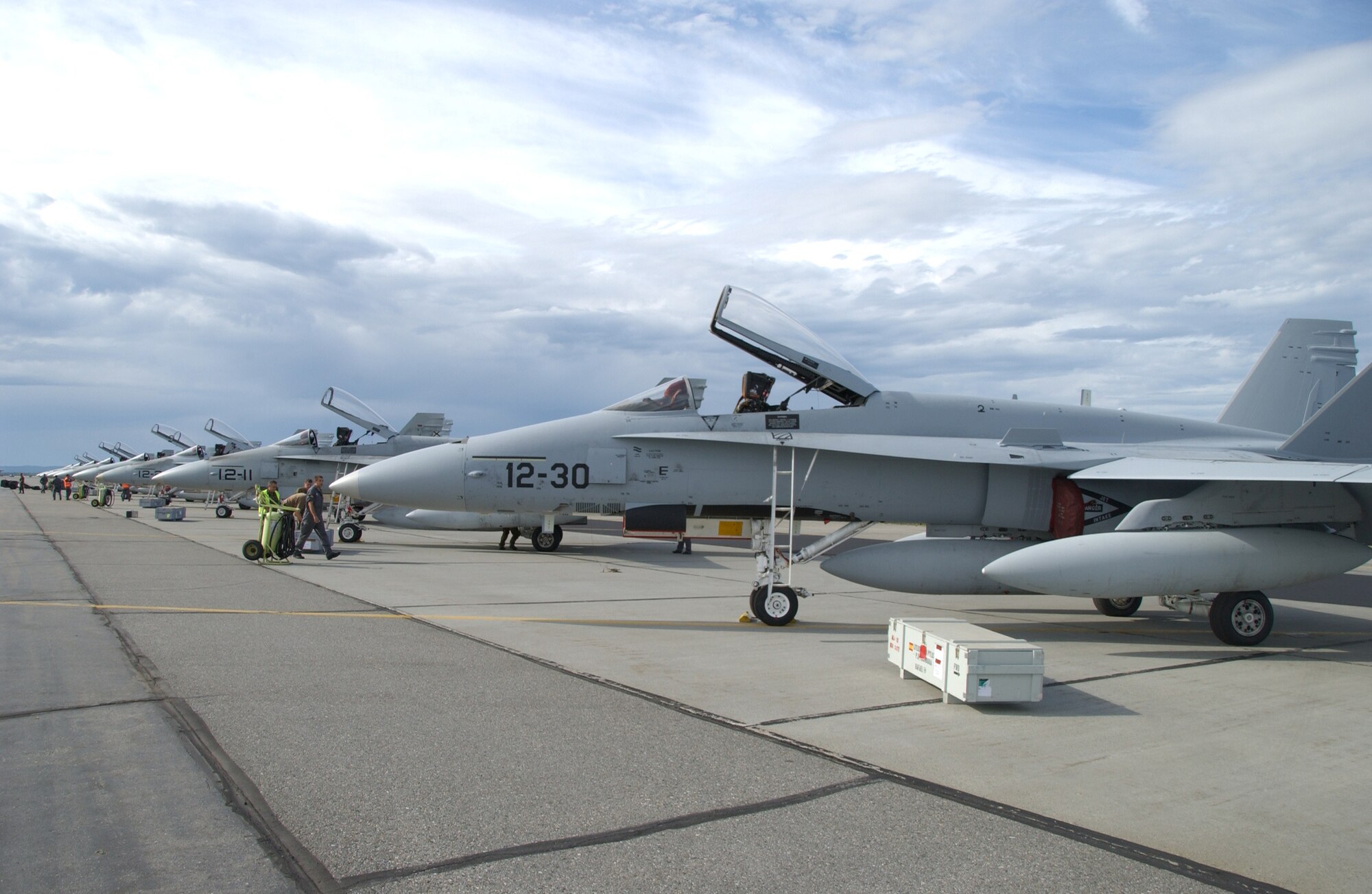EIELSON AIR FORCE BASE, Alaska -- 8 Spanish F-18's sit on the flight line waiting to be serviced before a training exercise July 10, 2007. Red Flag-Alaska, a series of Pacific Air Forces commander-directed field training exercises for U.S. forces, provides joint offensive counter-air, interdiction, close air support, and large force employment training in a simulated combat environment. (U.S. Air Force photo by Airman 1st Class Christopher Griffin)