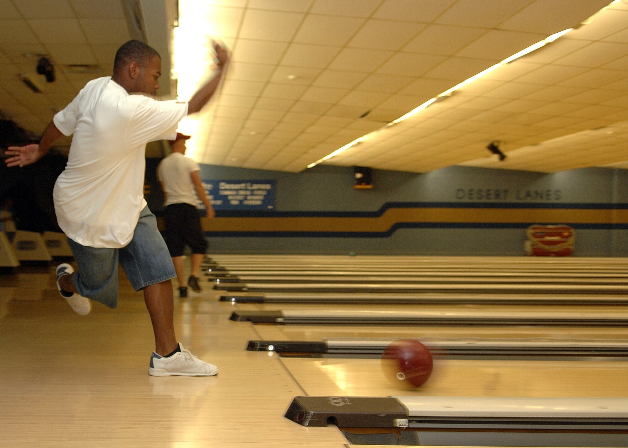 Mr. Tyrell Jordan, a dependent, bowls during the Freedom Fest bowling tournament here July 3. (U.S. Air Force photo by Airman 1st Class John Strong
