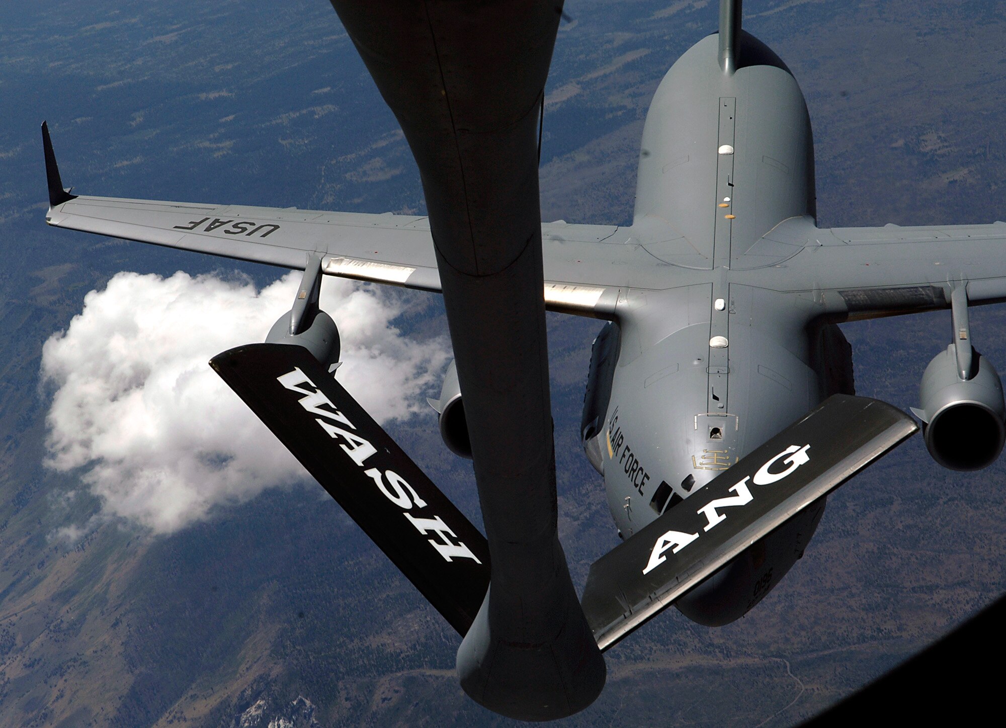 FAIRCHILD AIR FORCE BASE, Wash. – The boom of one of the 141st Air Refueling Wing’s KC-135 Stratotankers stretches out over another during a final formation flight July 7. The KC-135s will be relocated to the 185th Air Refueling Wing in Sioux City, Iowa. The 141st ARW will continue to work alongside the 92nd Air Refueling Wing. (U.S. Air Force photo/Airman 1st Class Joshua Chapman)