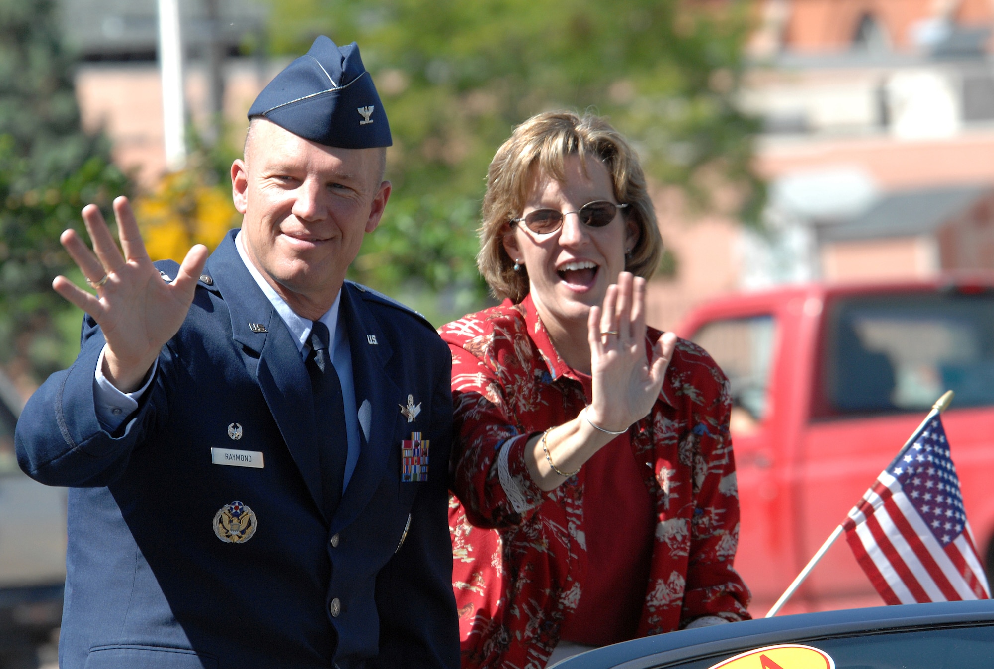 Col. Jay Raymond, 21st Space Wing commander, rides in the Pikes Peak or Bust Rodeo parade July 7 in Colorado Springs. The rodeo, which runs July 11 to 15, donates a percentage of its earnings to local military charities each year. Pictured riding with the colonel is his wife, Mollie. (U.S. Air Force photo by Duncan Wood)